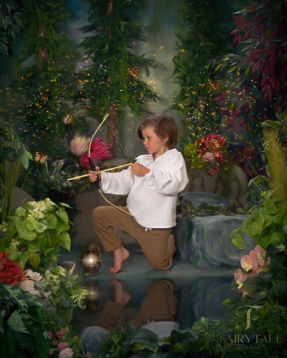 A child aiming a prop bow and arrow